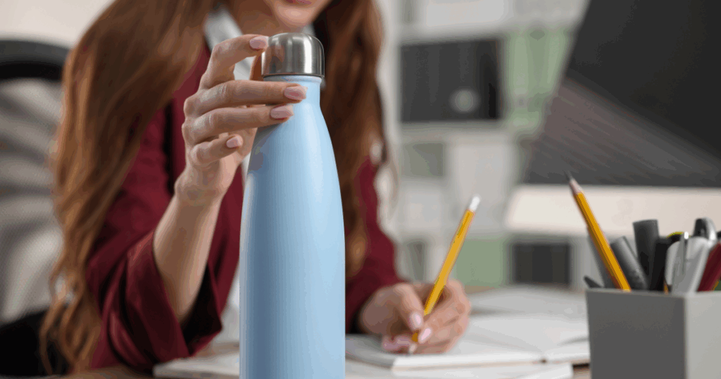 3-1024x538-1 woman working with water bottle on desk