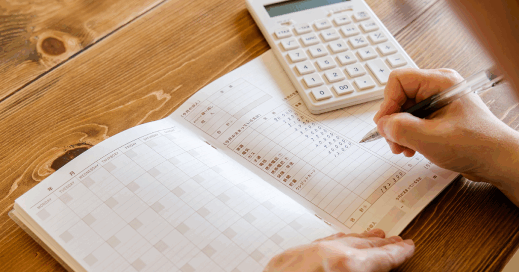 3-1024x538-2 hands with a budget book and calculator
