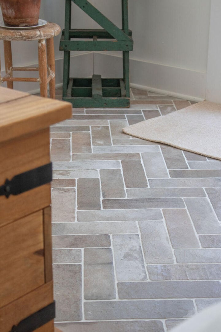 brick-herringbone-tile-floors-muted-color-the-honeycomb-home