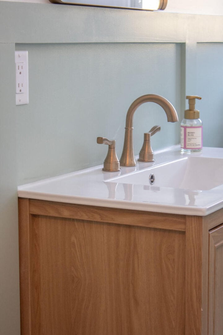 green-bathroom-with-brass-hardware-and-faucet-720x1080-1 green-bathroom-with-brass-hardware-and-faucet
