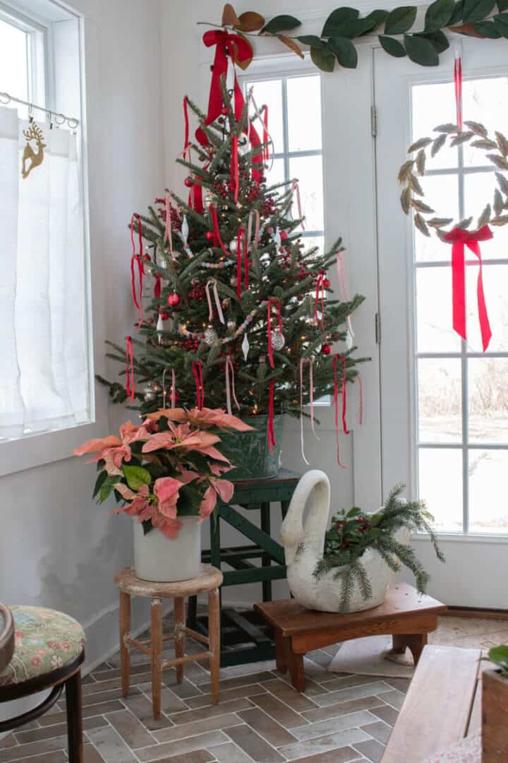 sunroom-christmas-tree-720x1080-1 Sunroom-Christmas-tree with red and pink ribbon in a green vintage bucket